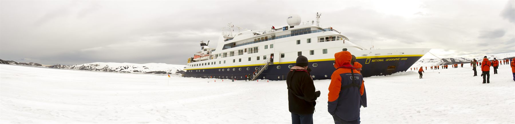 A cruise ship pushing into the fast ice in Antarctica